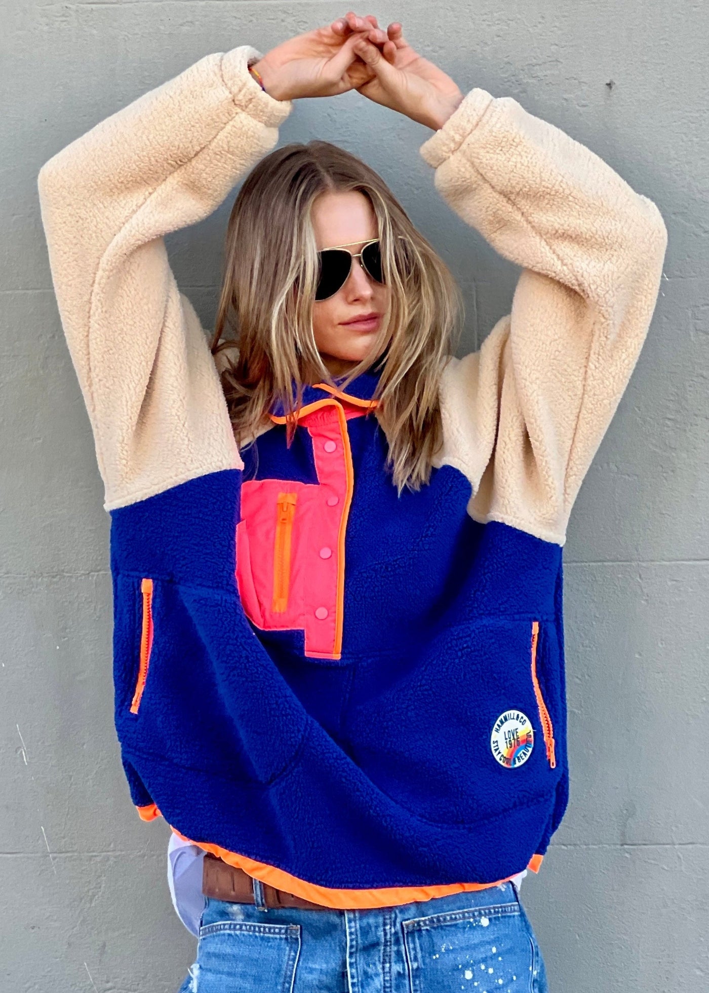 Hammill & Co super comfy and cozy new Alpes panelled polar fleece  with half button front in denim blue with raglan sleeves in a warm natural colour. Featuring contrast coloured front panel and orange coloured piping down the front. 