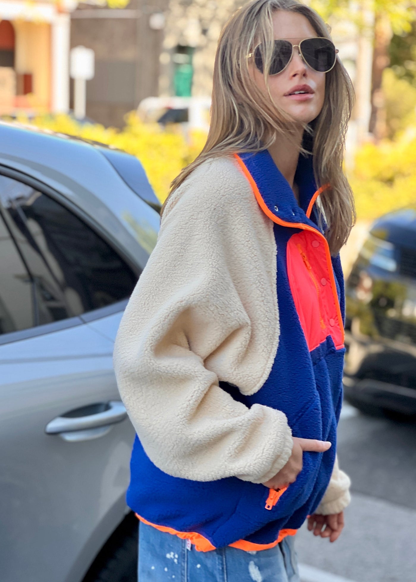 Hammill & Co super comfy and cozy new Alpes panelled polar fleece  with half button front in denim blue with raglan sleeves in a warm natural colour. Featuring contrast coloured front panel and orange coloured piping down the front. 
