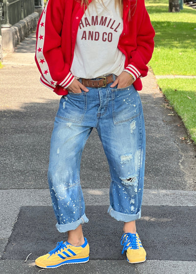 Hammill & Co Soft mid-blue colour stonewash non stretch denim
- Subtle paint splats, rips and holes for a lived in, vintage look.
- Slouchy utility pockets on the front and back
-  Waistband with belt loops.
- Concealed front button fly