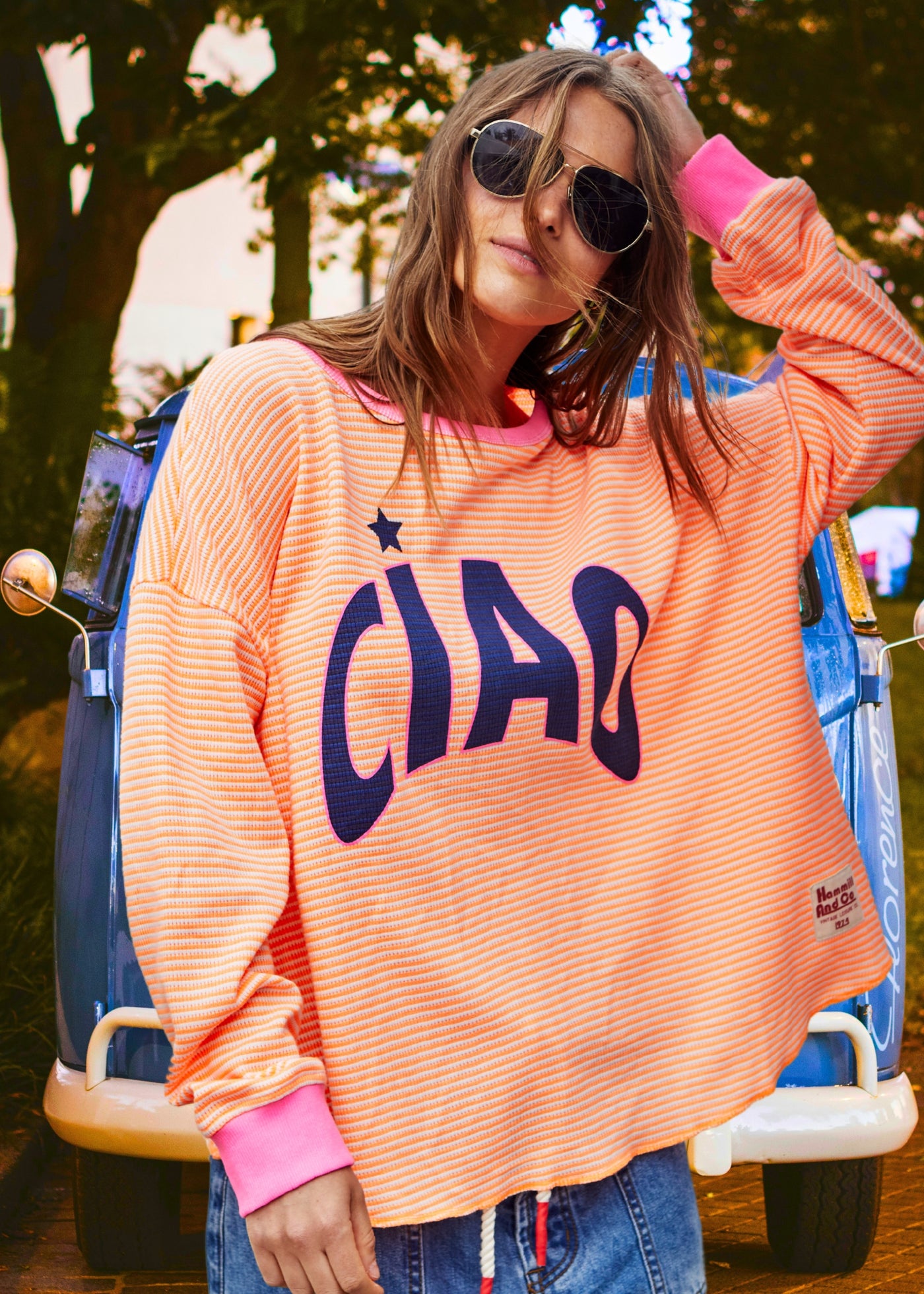 Hammill & Co Orange and white stripe rib waffle top with pink contrast rib and CIAO print on the front and keep smiling down the left sleeve. 