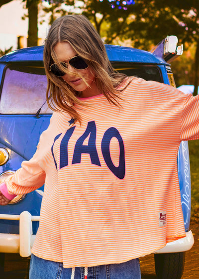 Hammill & Co Orange and white stripe rib waffle top with pink contrast rib and CIAO print on the front and keep smiling down the left sleeve. 