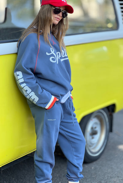 Hammill & Co New Sporty sweat is in a soft brushed fleece fabric in a washed denim blue colour with stripe rib cuffs. Cute printed Sporty print on the front and Word Series down each sleeve in washed white and Retro 1975 print across the back.