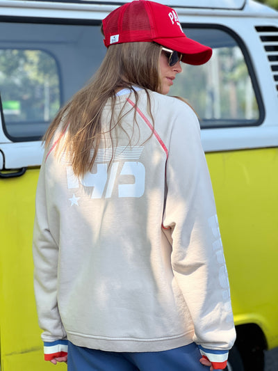 Hammill & Co New Sporty sweat is in a soft brushed fleece fabric in a washed natural colour with stripe rib cuffs. Distressed Red 75 print on the front and Word Series down each sleeve in washed white and Retro 1975 print across the back.