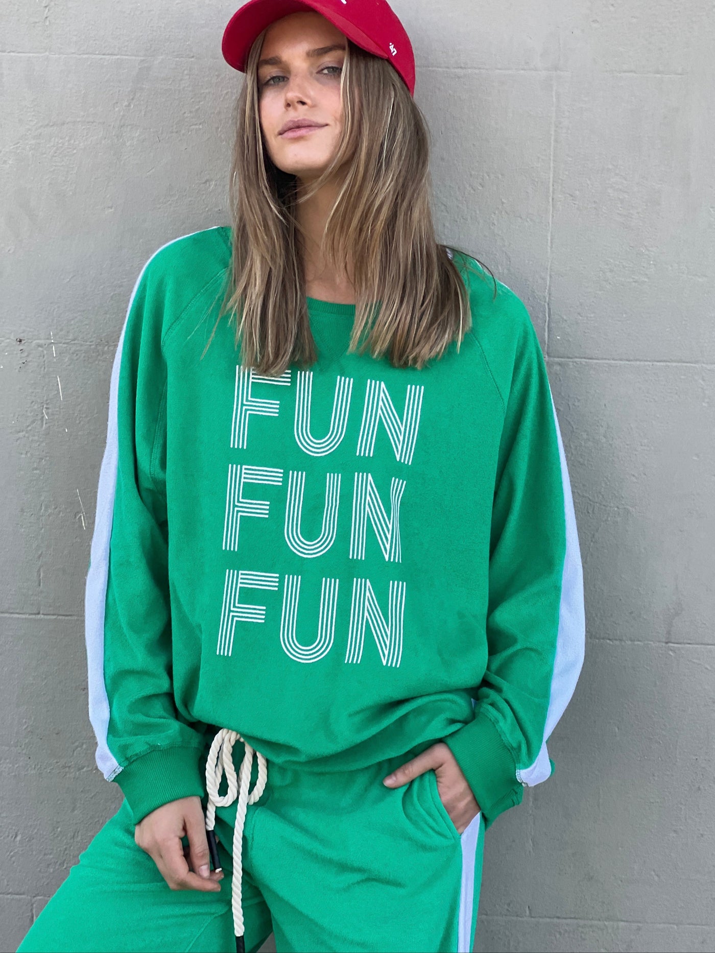 Hammill & Co lightweight, soft towelling sweat in green/white. Features our new Fun, Fun, Fun  print on the front, white panelled stripes down each sleeve, longer body length and rib waistband.