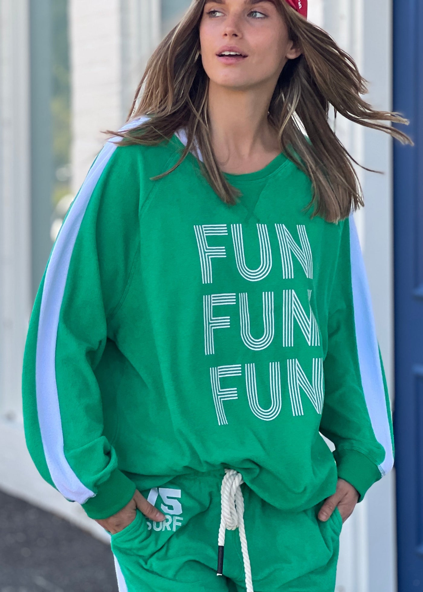 Hammill & Co lightweight, soft towelling sweat in green/white. Features our new Fun, Fun, Fun  print on the front, white panelled stripes down each sleeve, longer body length and rib waistband.