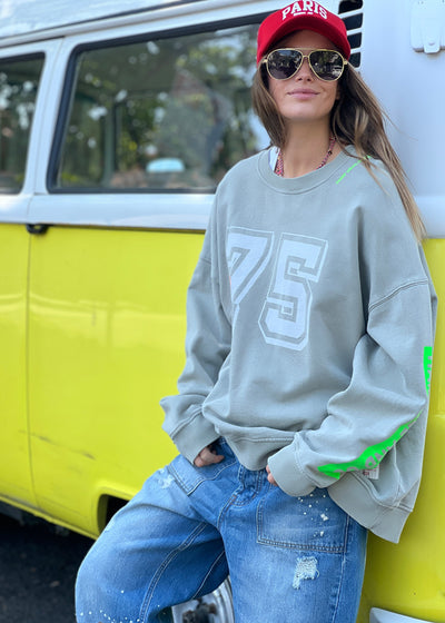 Hammill & Co longer, slouchier style sweat  in our new garment washed fleece.  Washed white 75 print on the front and neon print down the left sleeve. Pops of hot pink and neon green!
Happy vibes happy life embroidery at left side neck.  Soft 100% Washed Cotton fleece.