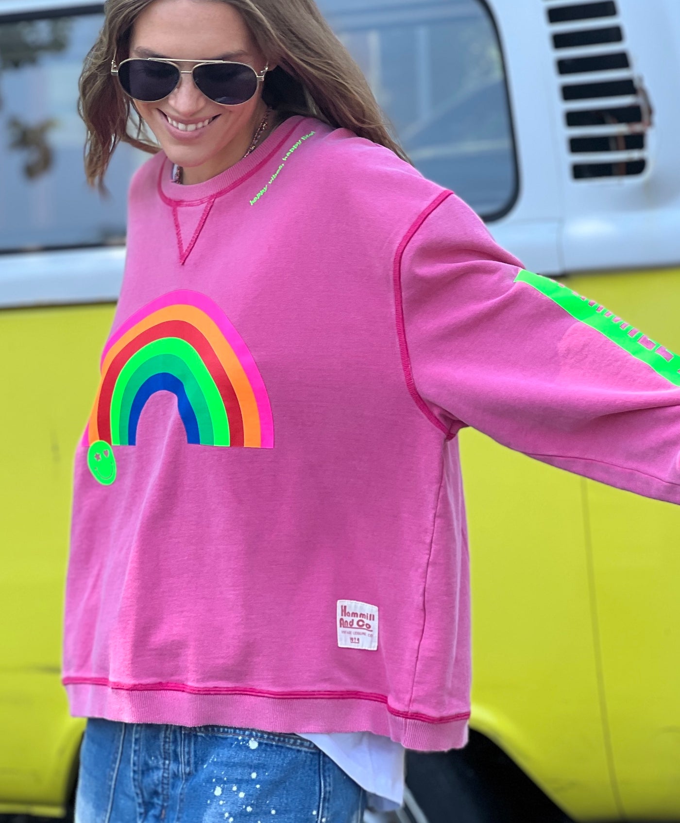 featured in a slouchy, crewneck silhouette with multi coloured rainbow print on the front and bold  Hammill & Co logo down the left sleeve. 