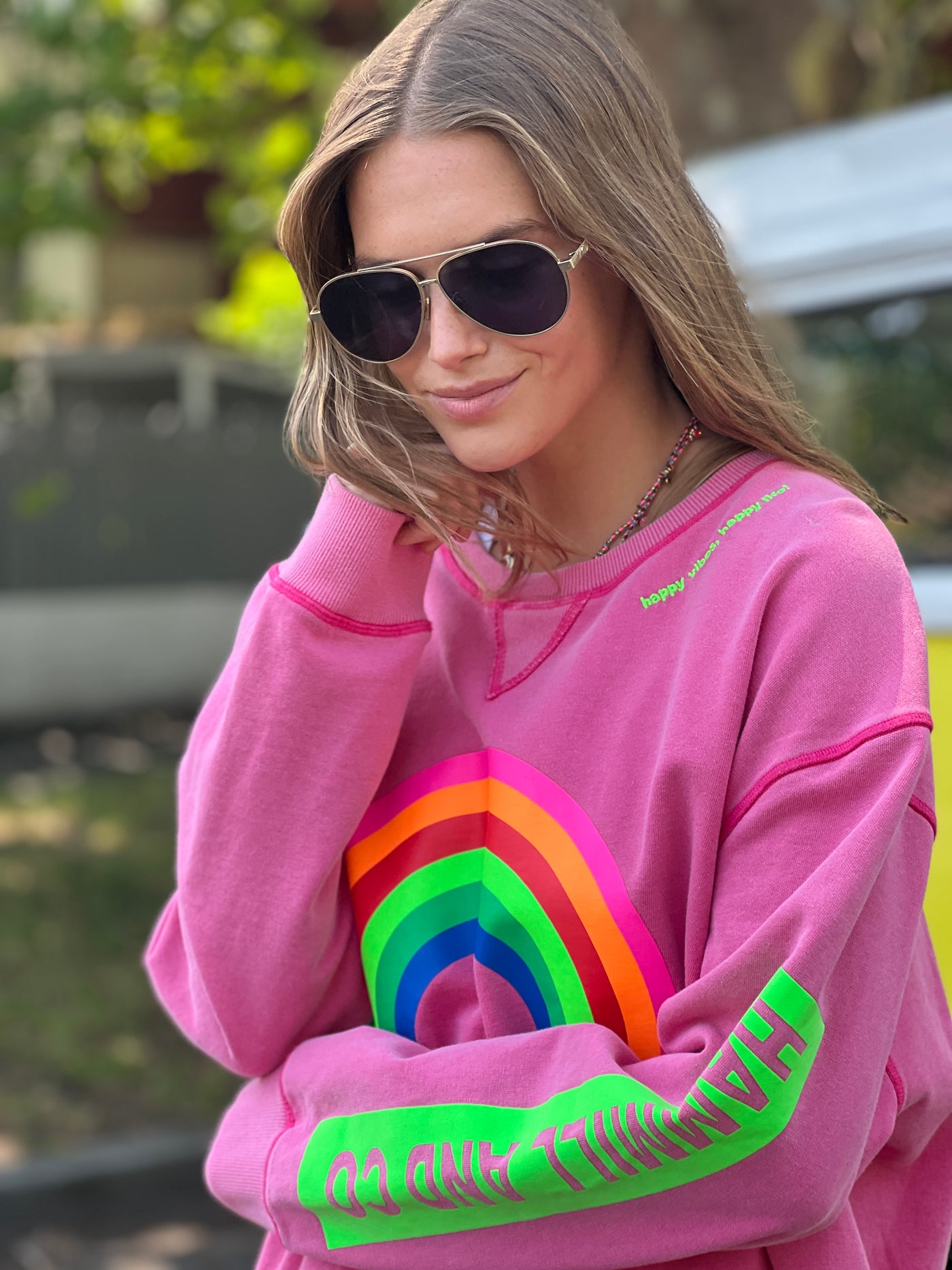 featured in a slouchy, crewneck silhouette with multi coloured rainbow print on the front and bold  Hammill & Co logo down the left sleeve. 