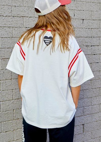 Hammill & Co tee with Rib panels on the sleeves and around the neck, peach cotton, La Vibe felt print on the front and small heart print on the back neck.