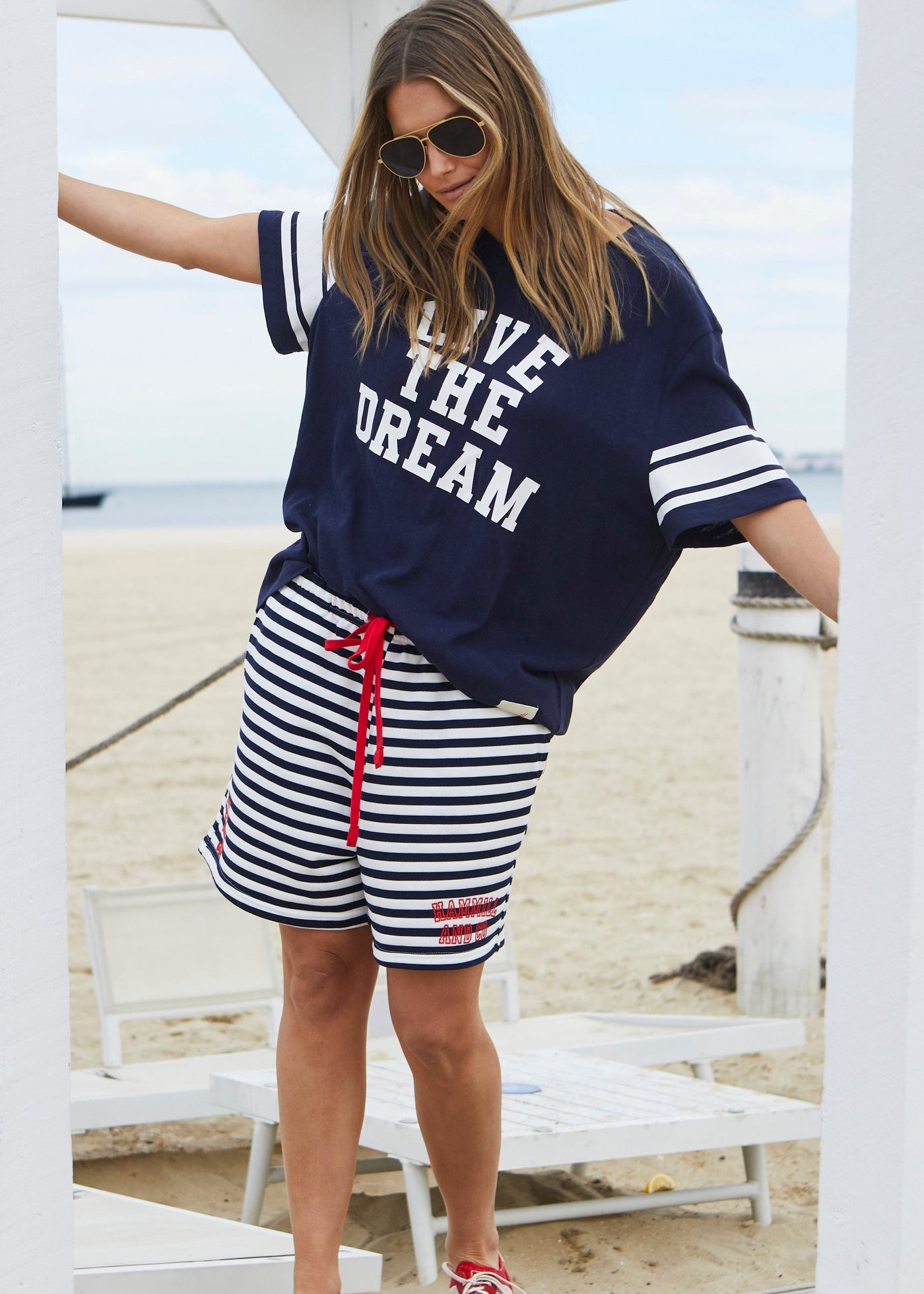 Hammill & Co Navy slouchy tee with Live the dream on the front and both sleeves have white printed stripes.