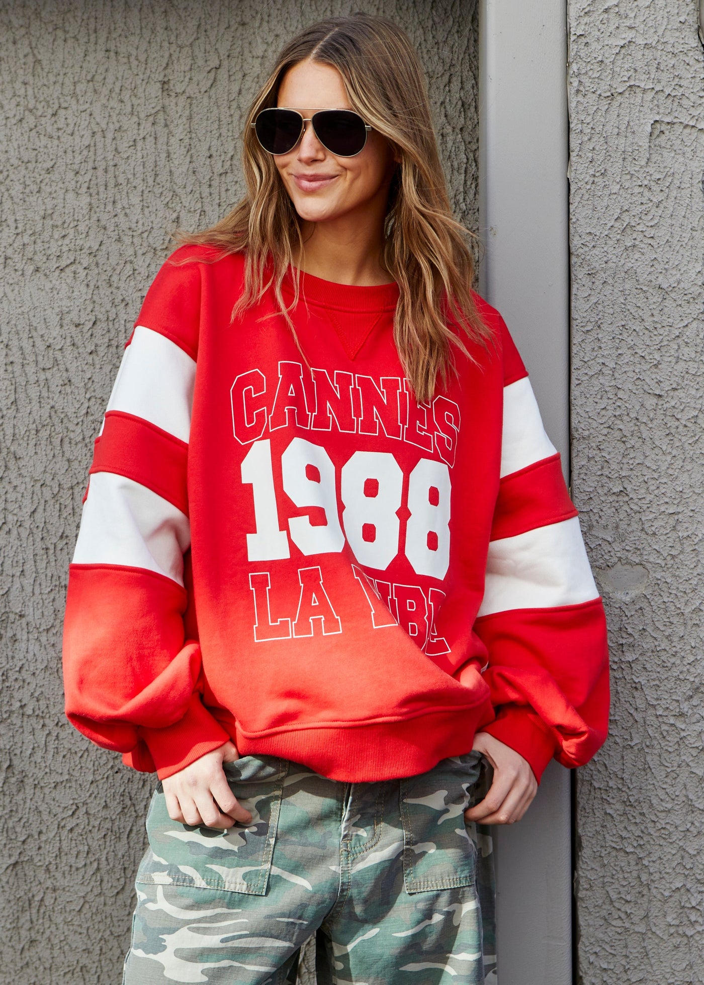 Hammill & Co Cannes 1988 red sweat panelled sweat with relaxed raglan sleeve and contrast panels with slight puff sleeve. The sweat is in a gorgeous washed red with natural panels and front chest print.