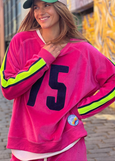 Hammill & Co slouchy sporty velour sweat in Hot pink with stripe tape down each sleeve and Sporty 75 chenille applique on the front.