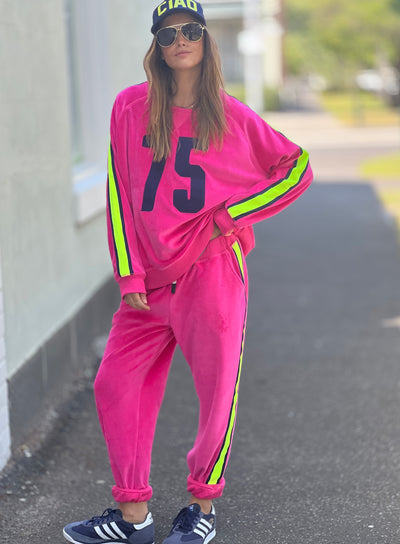 Hammill & Co slouchy sporty velour sweat in Hot pink with stripe tape down each sleeve and Sporty 75 chenille applique on the front.