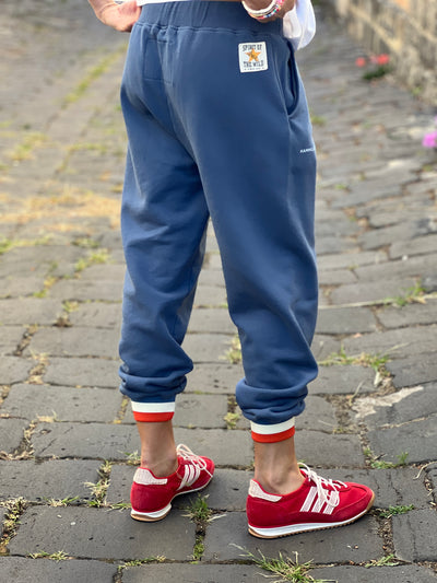 Hammill & Co Fleecy denim blue track pant with stripe cuffs, elastic waist band with draw cord, 7/8 length and small Hammill and Co logo on the right hip. Looks great worn back with the matching sweat.