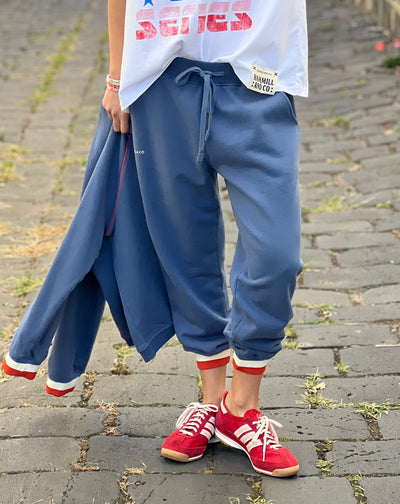 Hammill & Co Fleecy denim blue track pant with stripe cuffs, elastic waist band with draw cord, 7/8 length and small Hammill and Co logo on the right hip. Looks great worn back with the matching sweat.