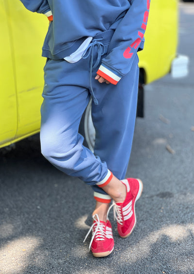 Hammill & Co Fleecy denim blue track pant with stripe cuffs, elastic waist band with draw cord, 7/8 length and small Hammill and Co logo on the right hip. Looks great worn back with the matching sweat.