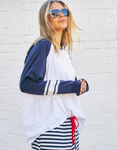 Hammill & Co Retro white long sleeve tee with contrast navy sleeves with pops of red print.