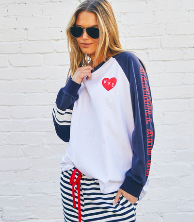 Hammill & Co Retro white long sleeve tee with contrast navy sleeves with pops of red print.