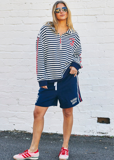Hammill & Co Our newest sweat  features open collar with zip detail, slight drop sleeve, sporty stripes and straight raw-cut hem. This fit is relaxed, wider body but still enough length for good coverage!