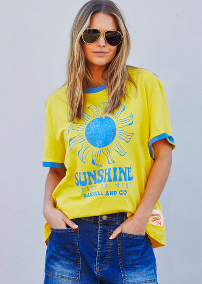 Hammill & Co Sunshine State of Mind tee in a slouchy V neck style in a soft bright yellow slub jersey with royal blue print on the front .