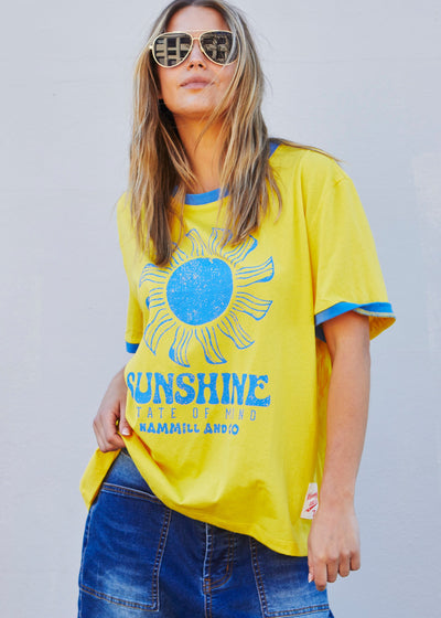 Hammill & Co Sunshine State of Mind tee in a slouchy V neck style in a soft bright yellow slub jersey with royal blue print on the front .