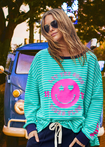 Hammill & Co Green and white stripe rib waffle long sleeve tee with navy contrast rib and pink Smily print on the front and keep smiling down the left sleeve. 