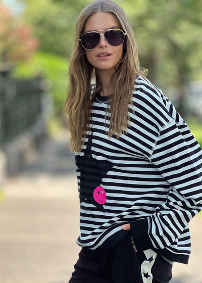 Hammill & Co Black and white stripe rib waffle top with contrast black rib collar and cuffs. New Star and smiling print on the front.