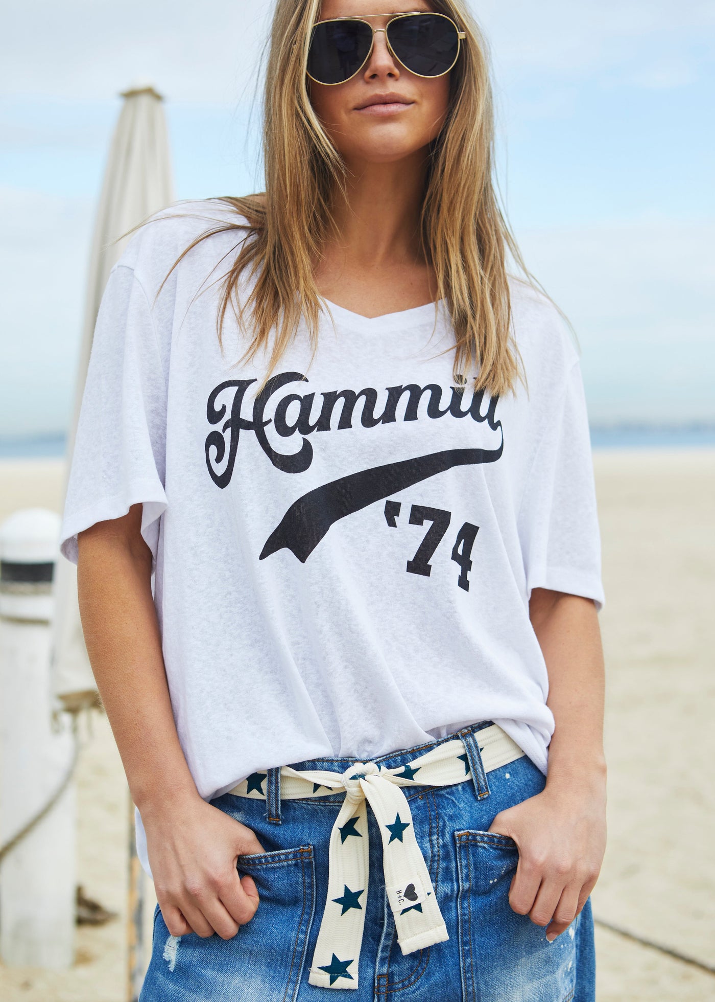 Hammill & Co Stretch natural tape with navy stars printed on one side and the other side plain. The end has small H+C badge.