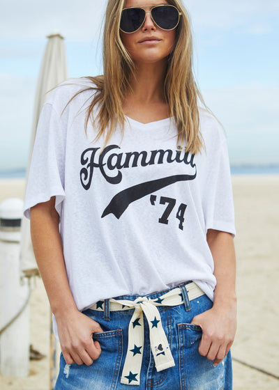 Hammill & Co Stretch natural tape with navy stars printed on one side and the other side plain. The end has small H+C badge.