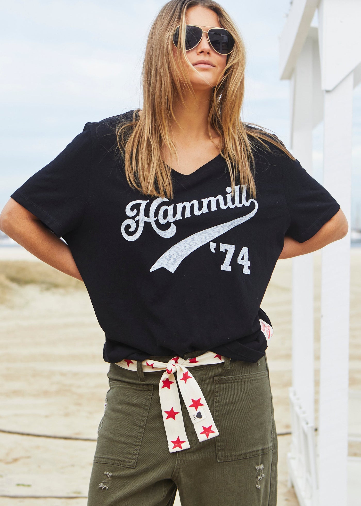 Hammill & Co Stretch natural tape with red stars printed on one side and the other side plain. The end has small H+C badge.