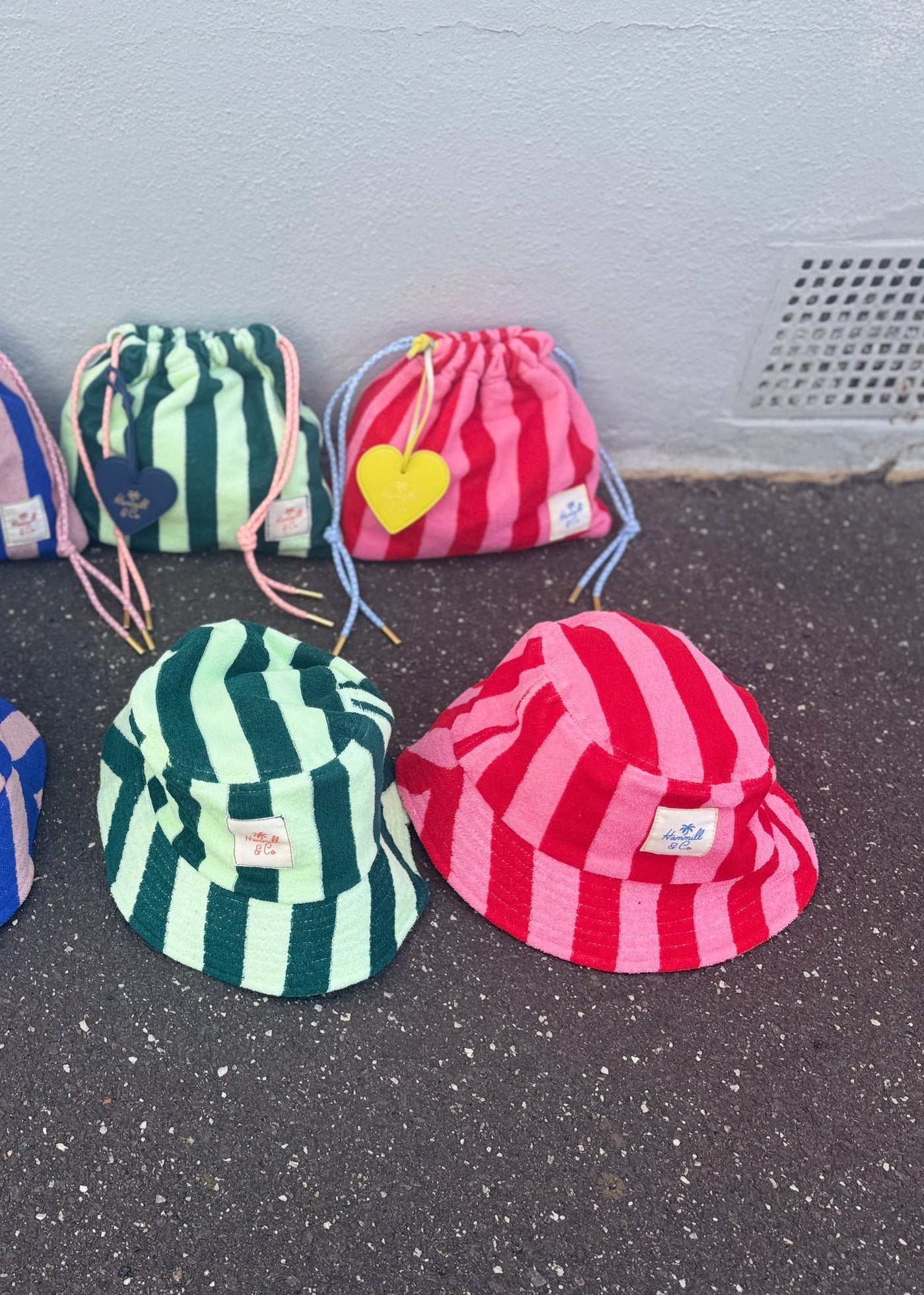 Hammill & Co bold striped bucket hat is pure summer happiness. Made from soft terry towelling in vibrant green/mint stripes, it adds a playful pop to any outfit. 