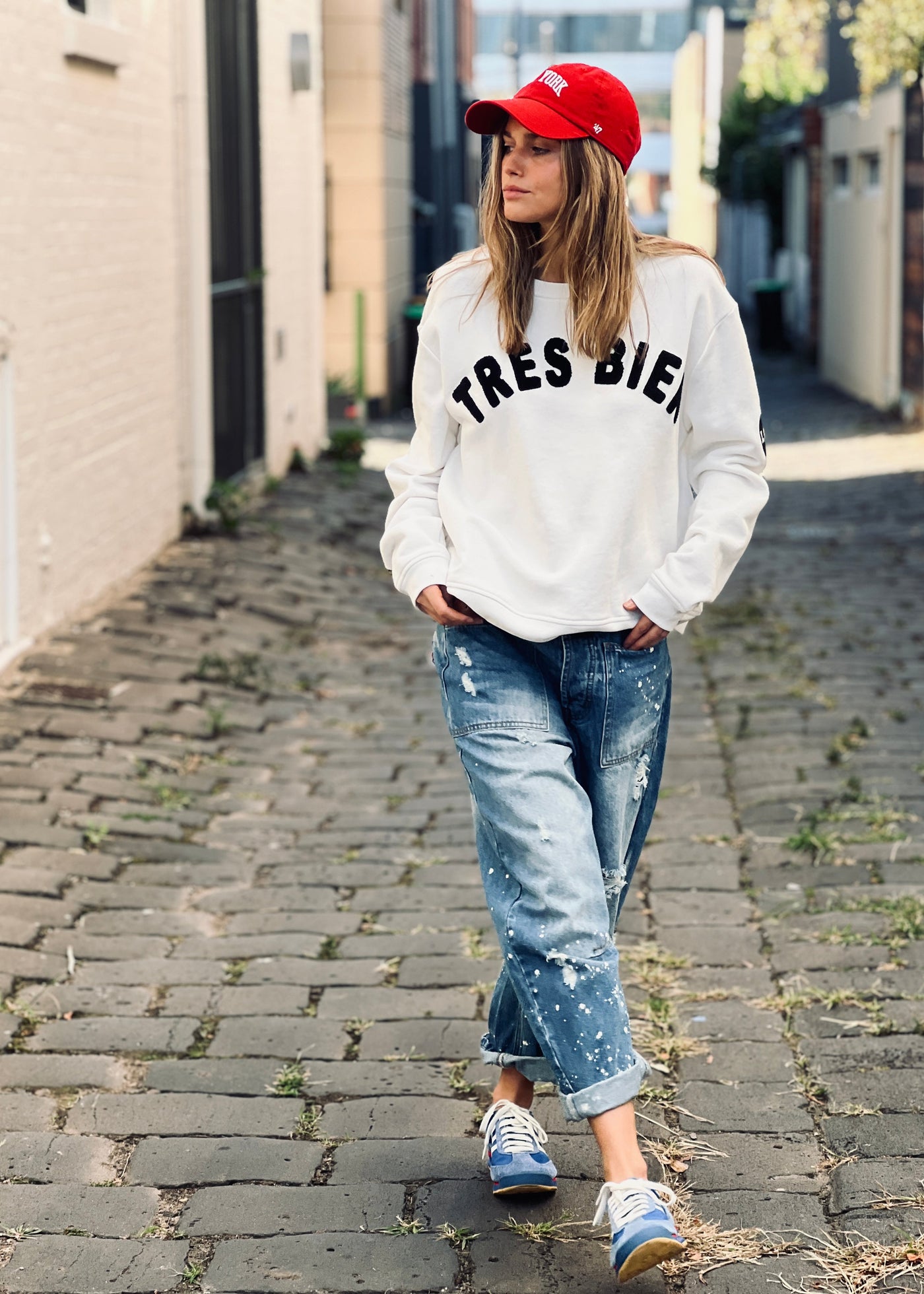 Soft unbrushed fleece in off white body colour with black Tres Bien chenille applique on the front and black printed LOVE heart on the left elbow. HAMMILL AND CO