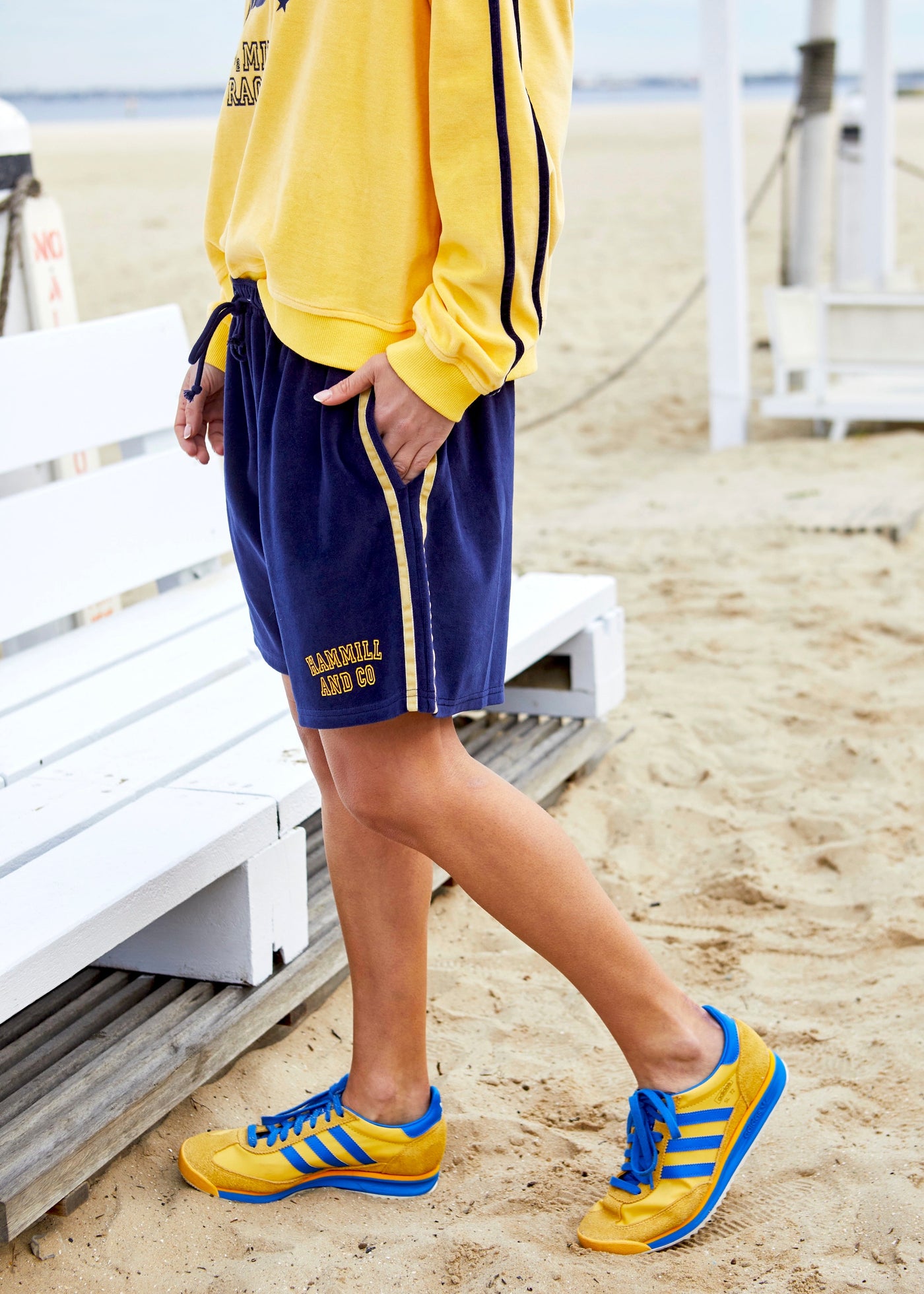 Hammill & Co These shorts are in our luxurious, lightweight velour with velour stripes down each leg, draw cord and Hammill and Co logo print on the left hem. The fit is a true to size, not oversized.