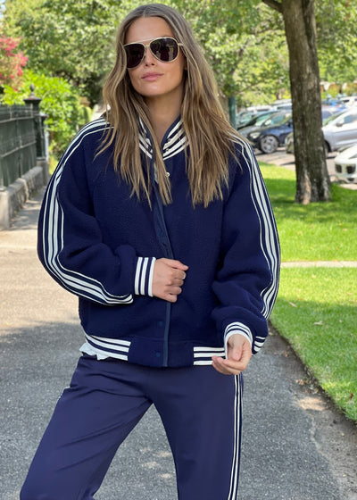 Hammill & Co cool relaxed bomber style  in superior quality polar fleece jacket with contrast natural and navy stripe tape down each sleeve.