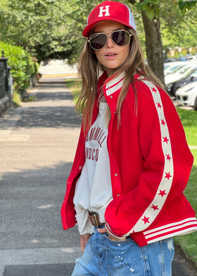 Hammill & Co cool relaxed bomber style  in superior quality polar fleece jacket with contrast natural tape down each sleeve with red printed stars.