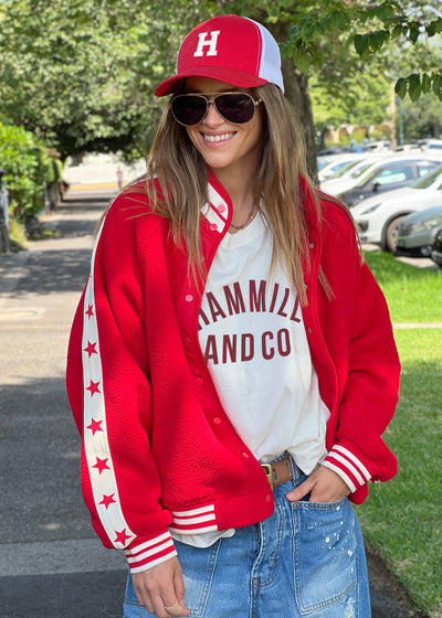 Hammill & Co cool relaxed bomber style  in superior quality polar fleece jacket with contrast natural tape down each sleeve with red printed stars.