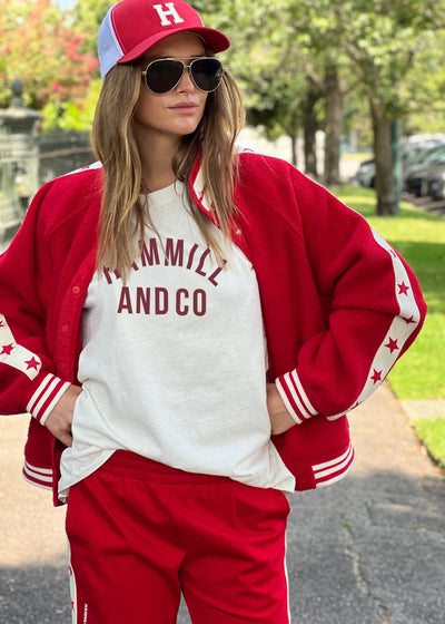 Hammill & Co cool relaxed bomber style  in superior quality polar fleece jacket with contrast natural tape down each sleeve with red printed stars.