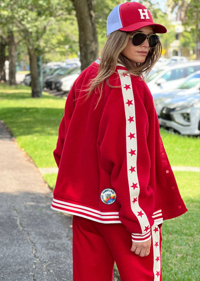 Hammill & Co cool relaxed bomber style  in superior quality polar fleece jacket with contrast natural tape down each sleeve with red printed stars.