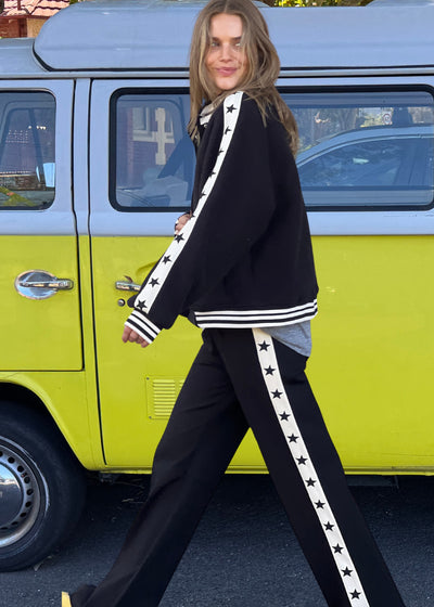 Hammill & Co wider leg street pant is a new addition to our track pant offering, an easy pull versatile style that is super comfy yet super stylish which can be dressed up or down!
Relaxed Varsity wider leg casual track pant with contrast tape down both legs with stars.