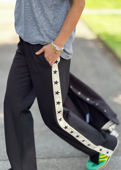 Hammill & Co wider leg street pant is a new addition to our track pant offering, an easy pull versatile style that is super comfy yet super stylish which can be dressed up or down!
Relaxed Varsity wider leg casual track pant with contrast tape down both legs with stars.