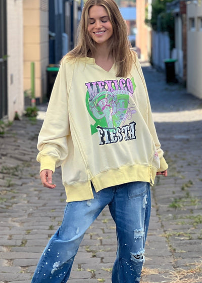 Hammill & Co oversized vintage wash sweat featuring raw cut v, exposed seams, wider rib waistband with side splits, raglan sleeve and new Mexican Fiesta print on the front and hand drawn logo on the back neck.